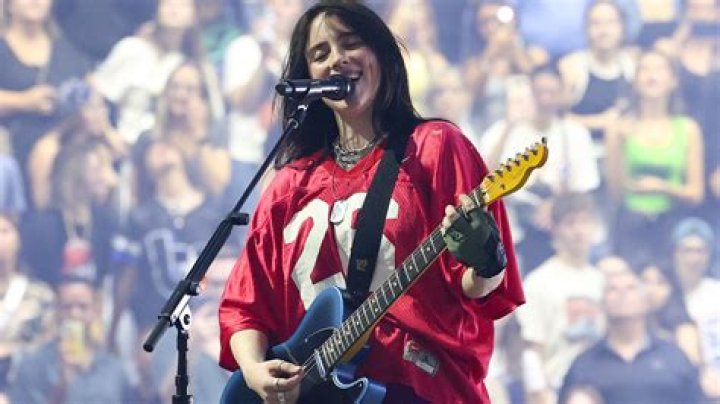 
Man climbs 162-foot KTLA tower in California with guitar, holding ‘Free Billie Eilish’ sign 